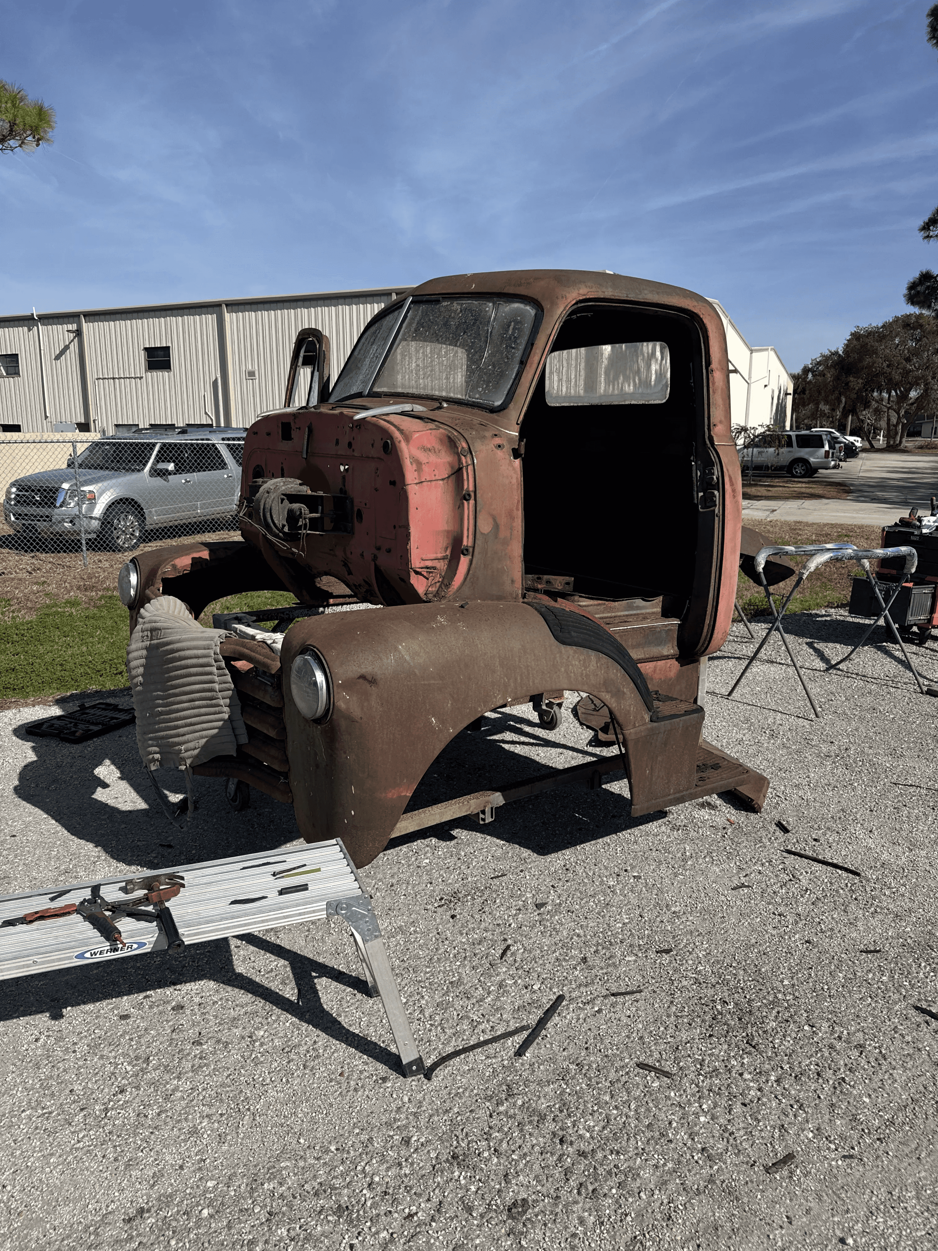Classic truck cab with rust and aged paint before sand blasting