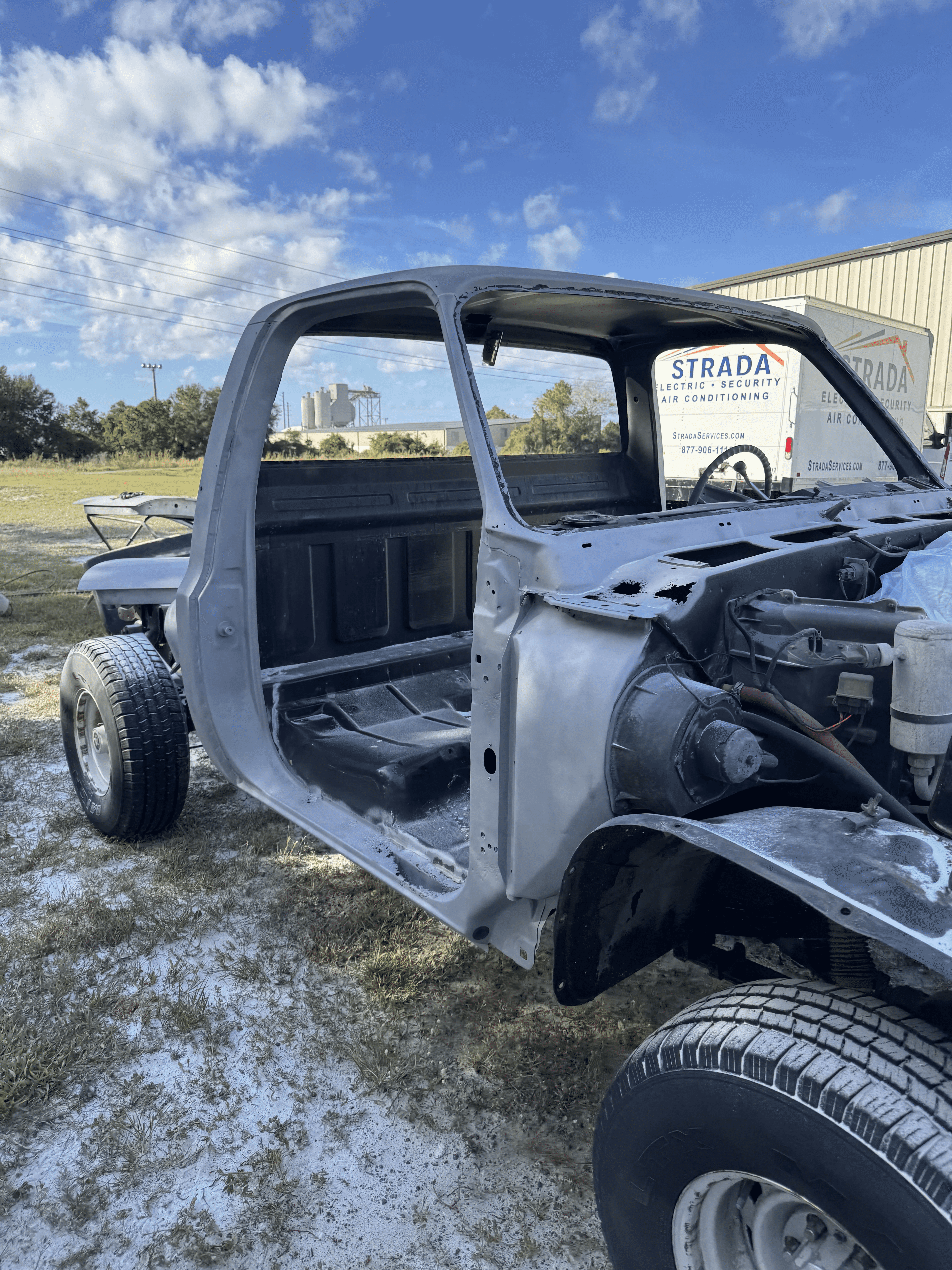 Truck cab front section after old paint and rust removal