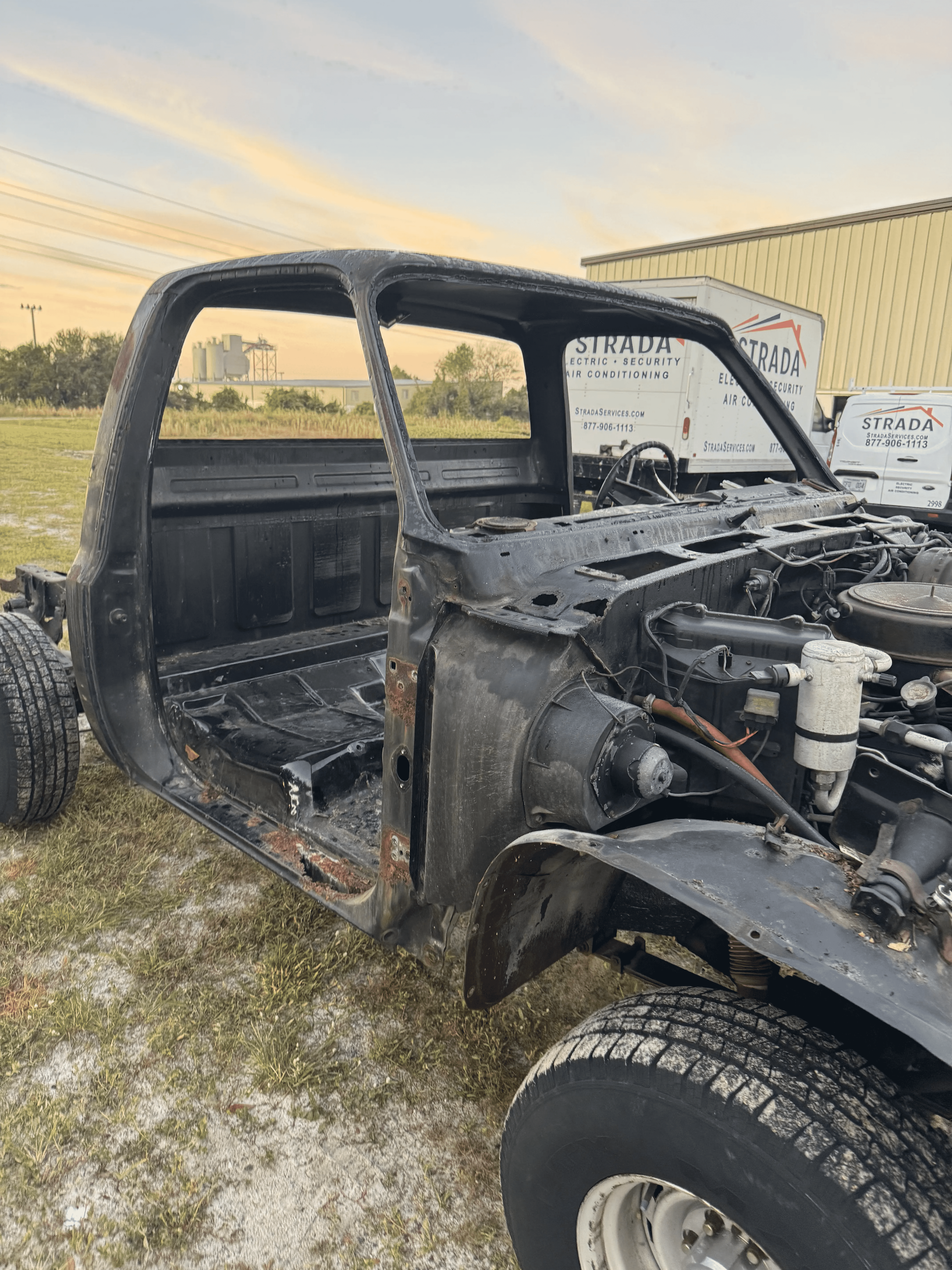 Truck cab front section with surface rust before blasting