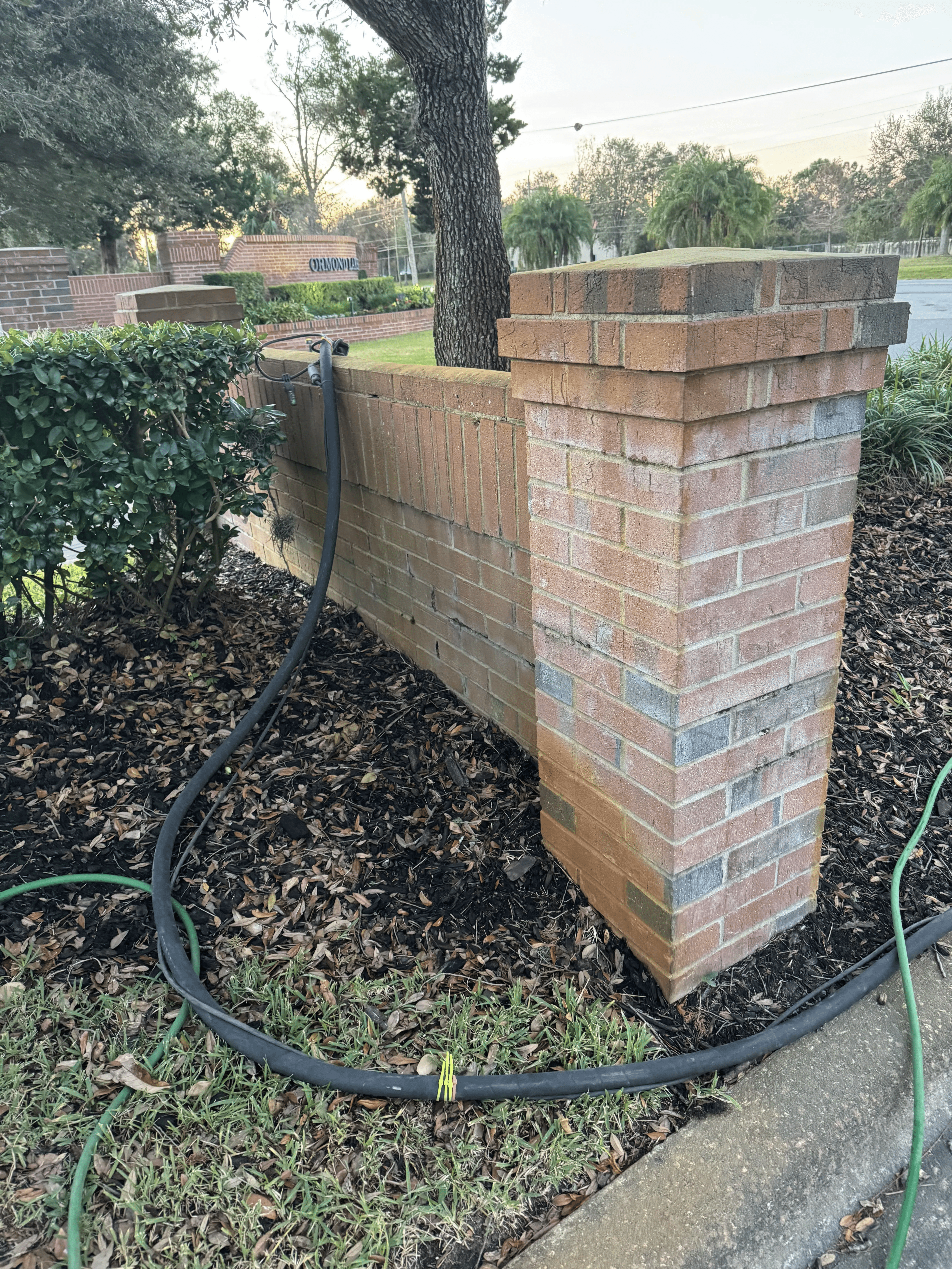 Brick wall and column before masonry surface restoration
