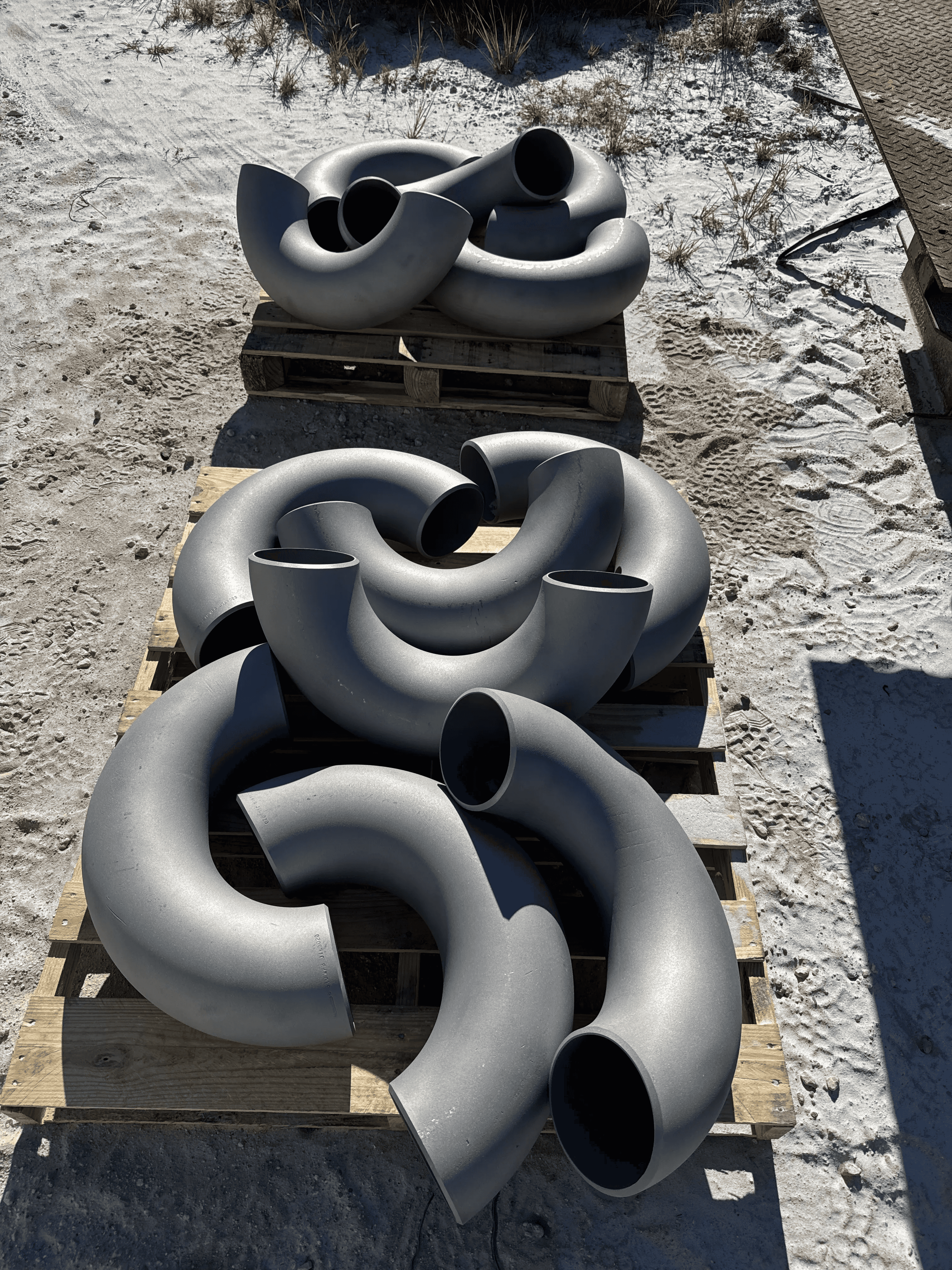 Industrial pipe fittings after blasting