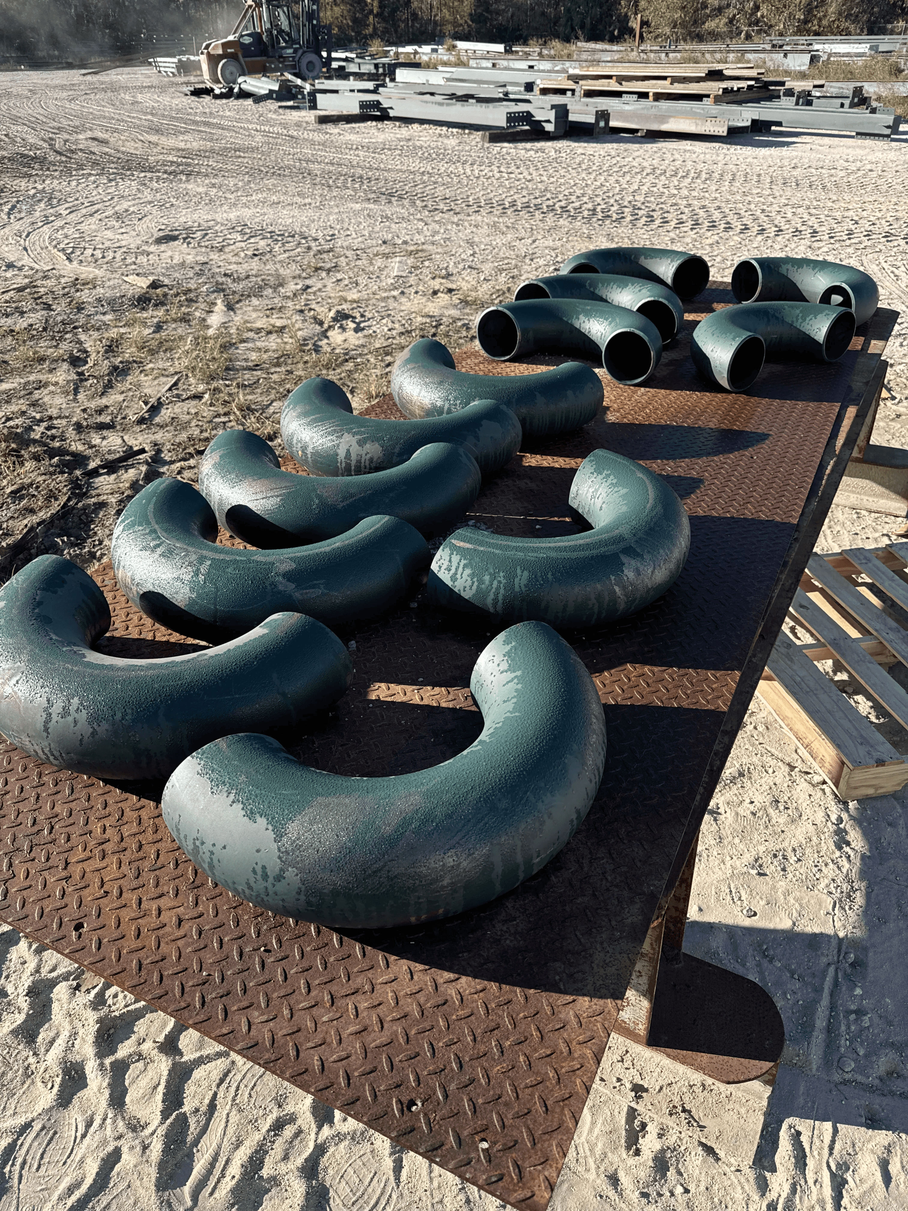 Industrial pipe fittings before blasting