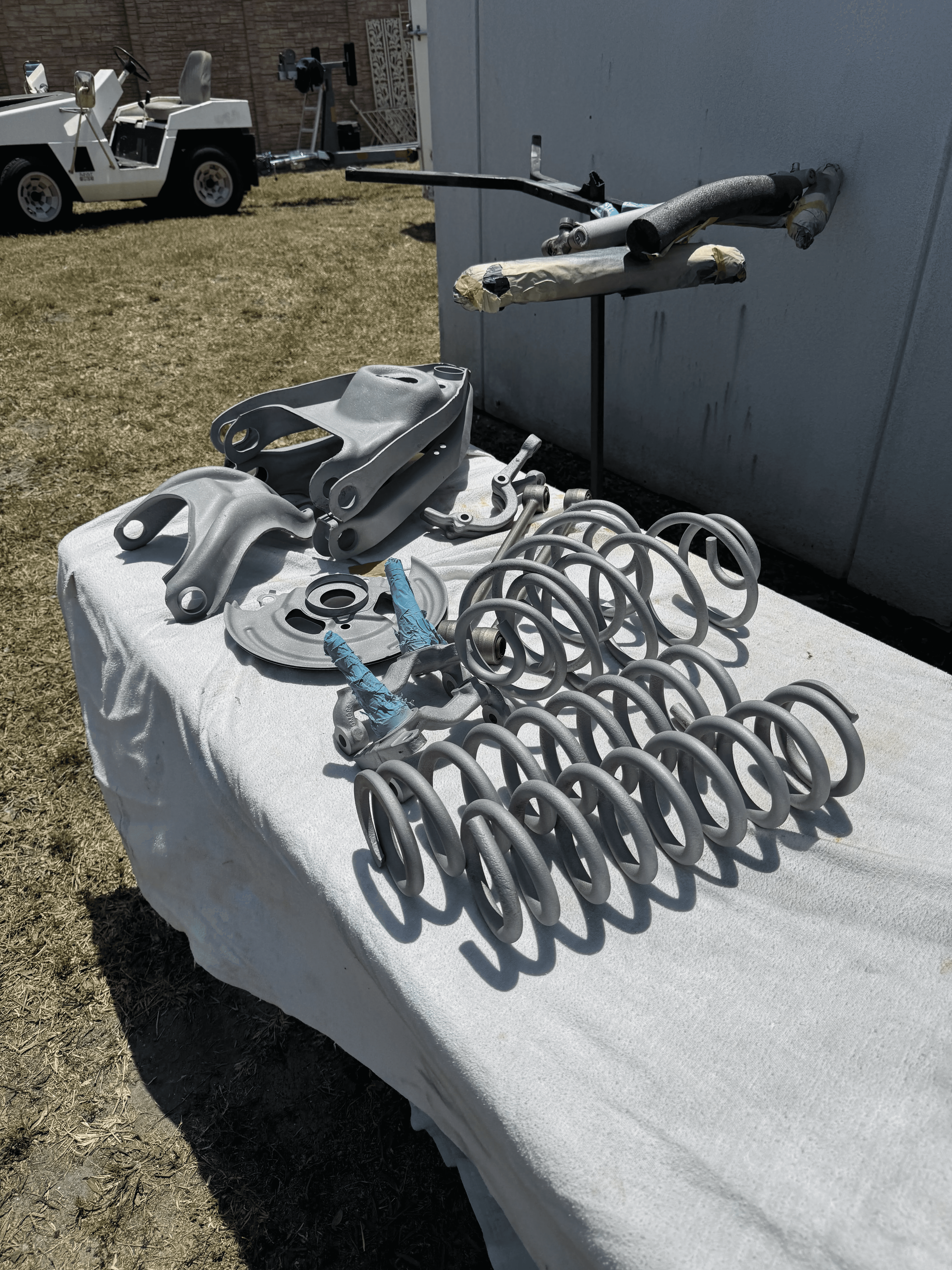 Automotive suspension parts after sand blasting removed rust