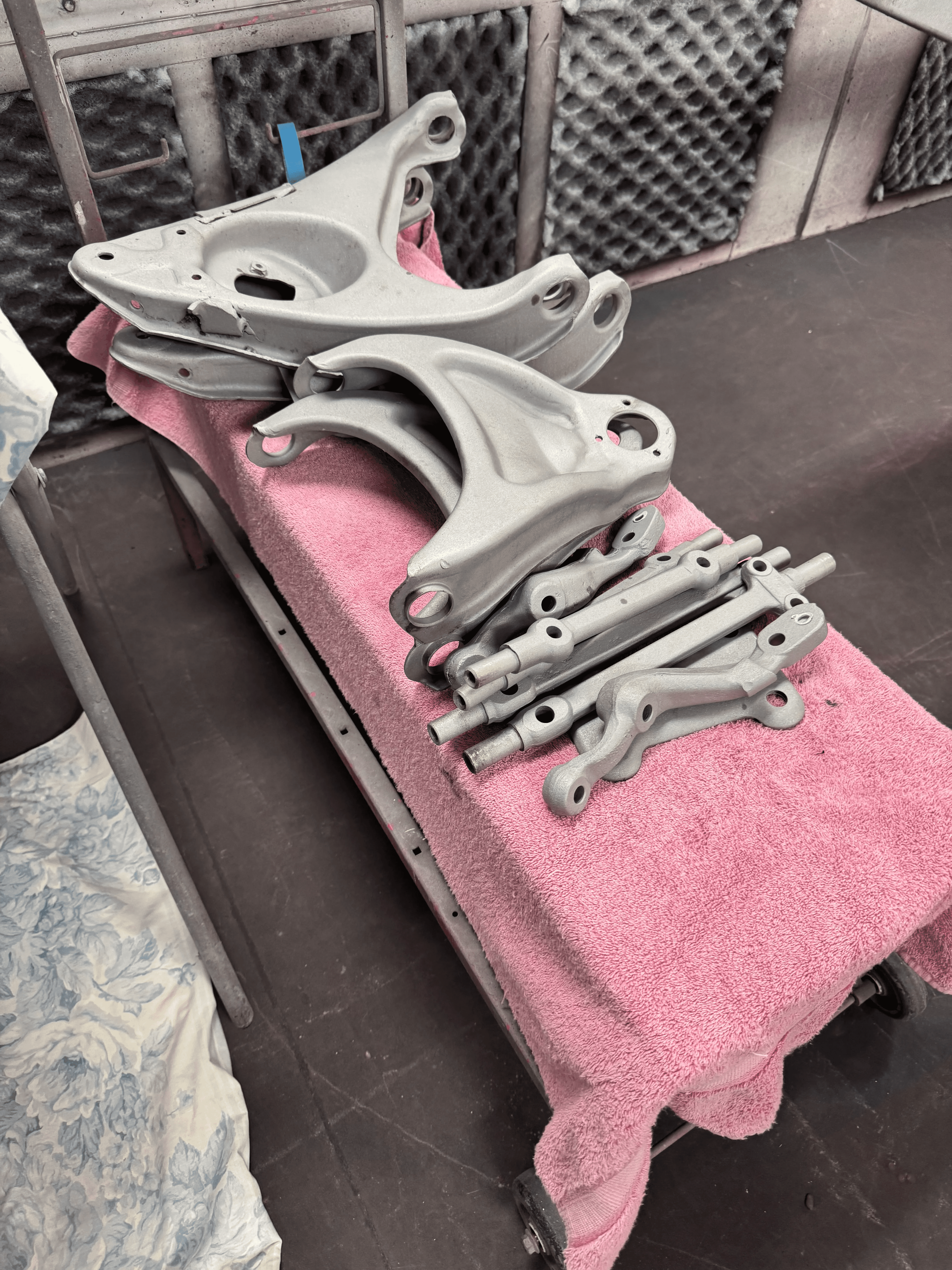 Automotive metal parts after sand blasting and surface preparation