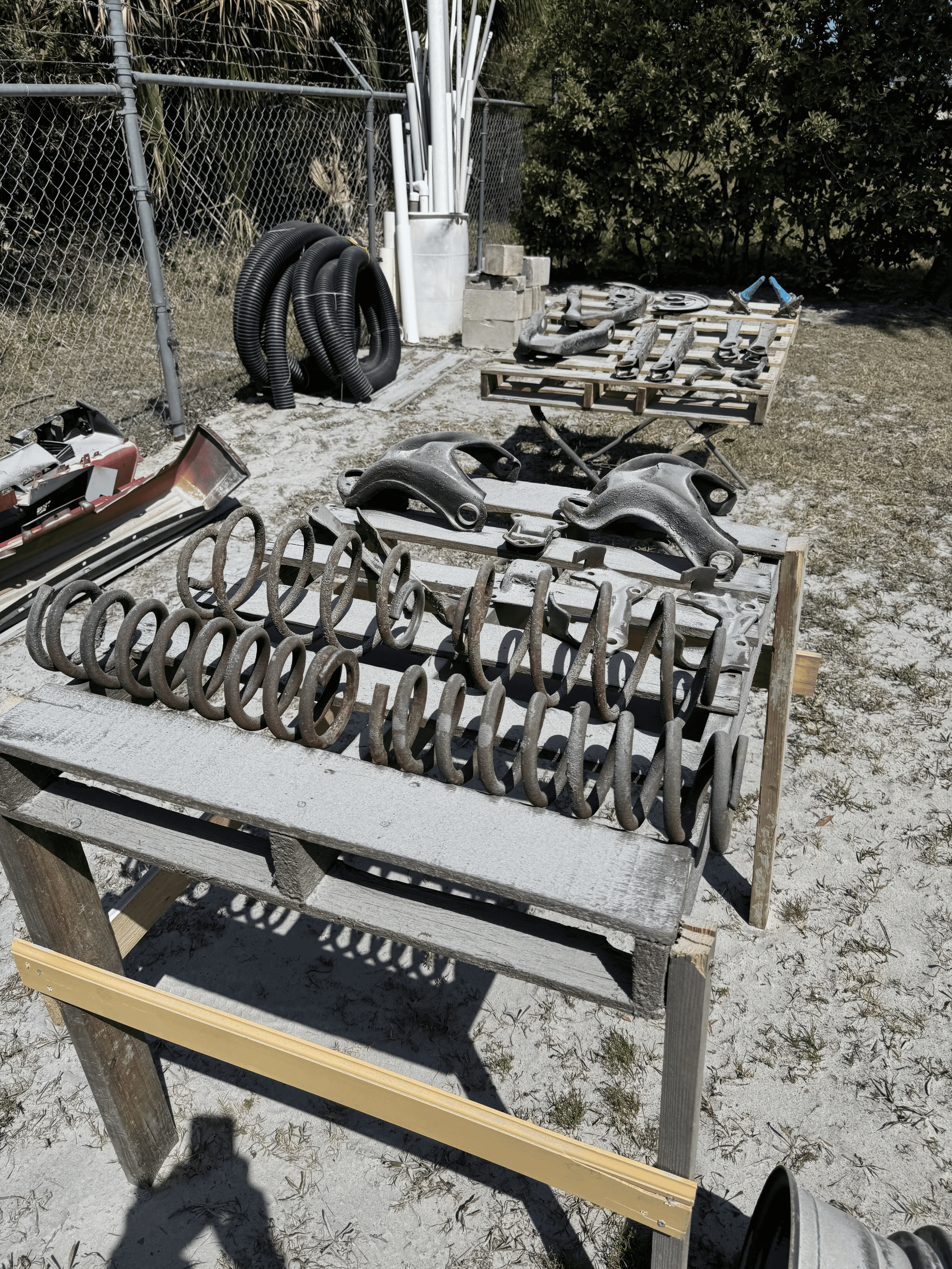 Automotive springs and metal components before rust removal