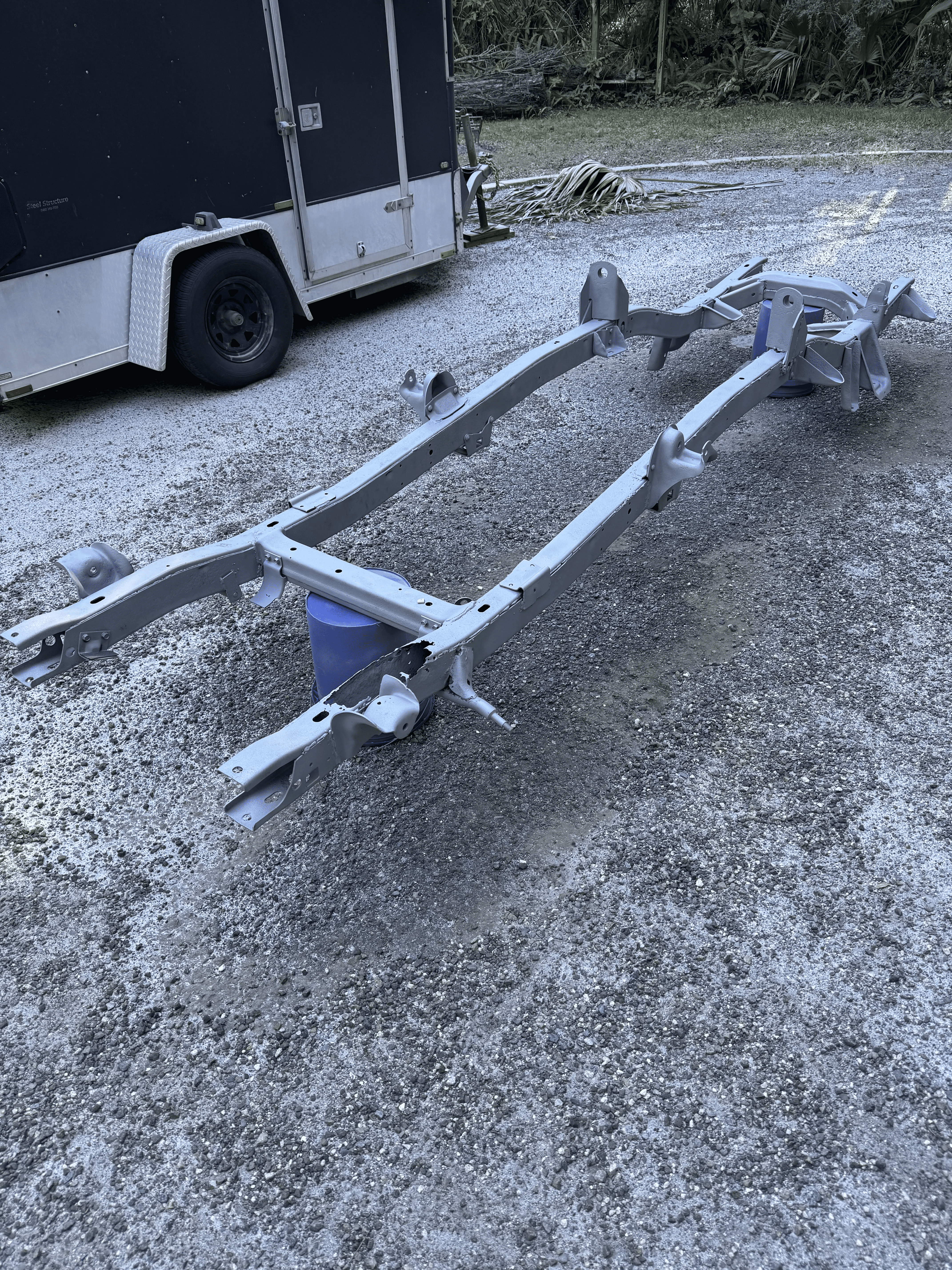 Automotive frame after sand blasting removed rust and old coating
