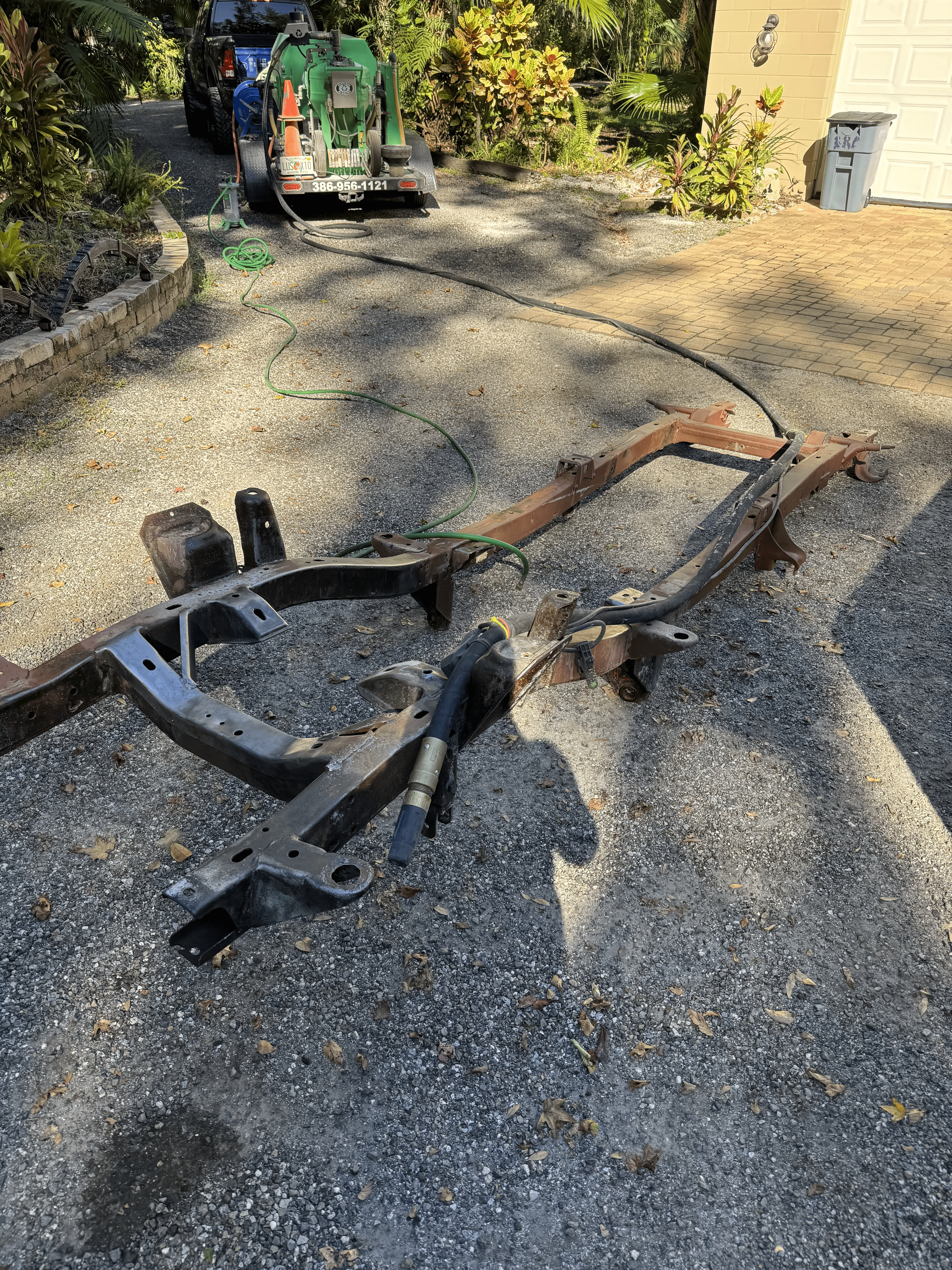 Automotive frame with rust and old coating before sand blasting